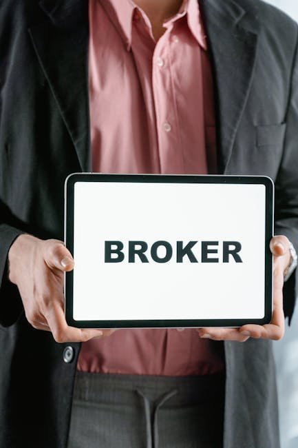 Guy holding a sign for Broker